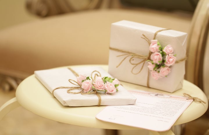 two pink and white floral boxes