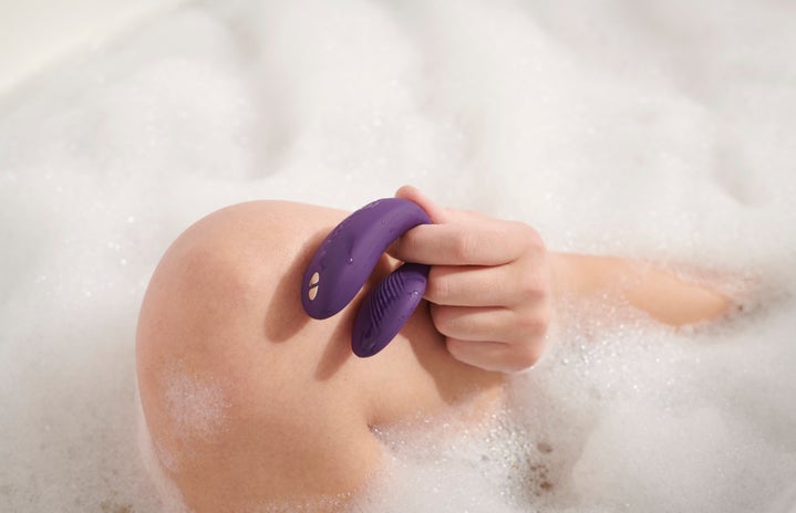 person holding couples vibrator in the bathtub?width=719&height=464&fit=crop&auto=webp