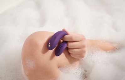 person holding couples vibrator in the bathtub?width=398&height=256&fit=crop&auto=webp