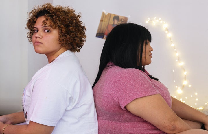 two unhappy multiracial women in room?width=719&height=464&fit=crop&auto=webp