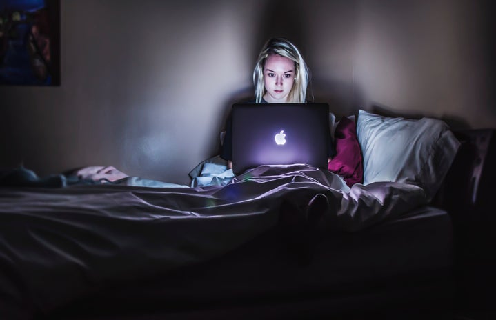 Person in bed at night on computer by Victoria Heath?width=719&height=464&fit=crop&auto=webp