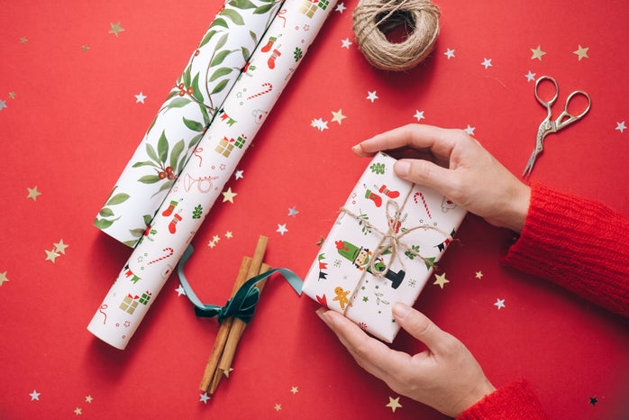 Gift held in hands with wrapping paper