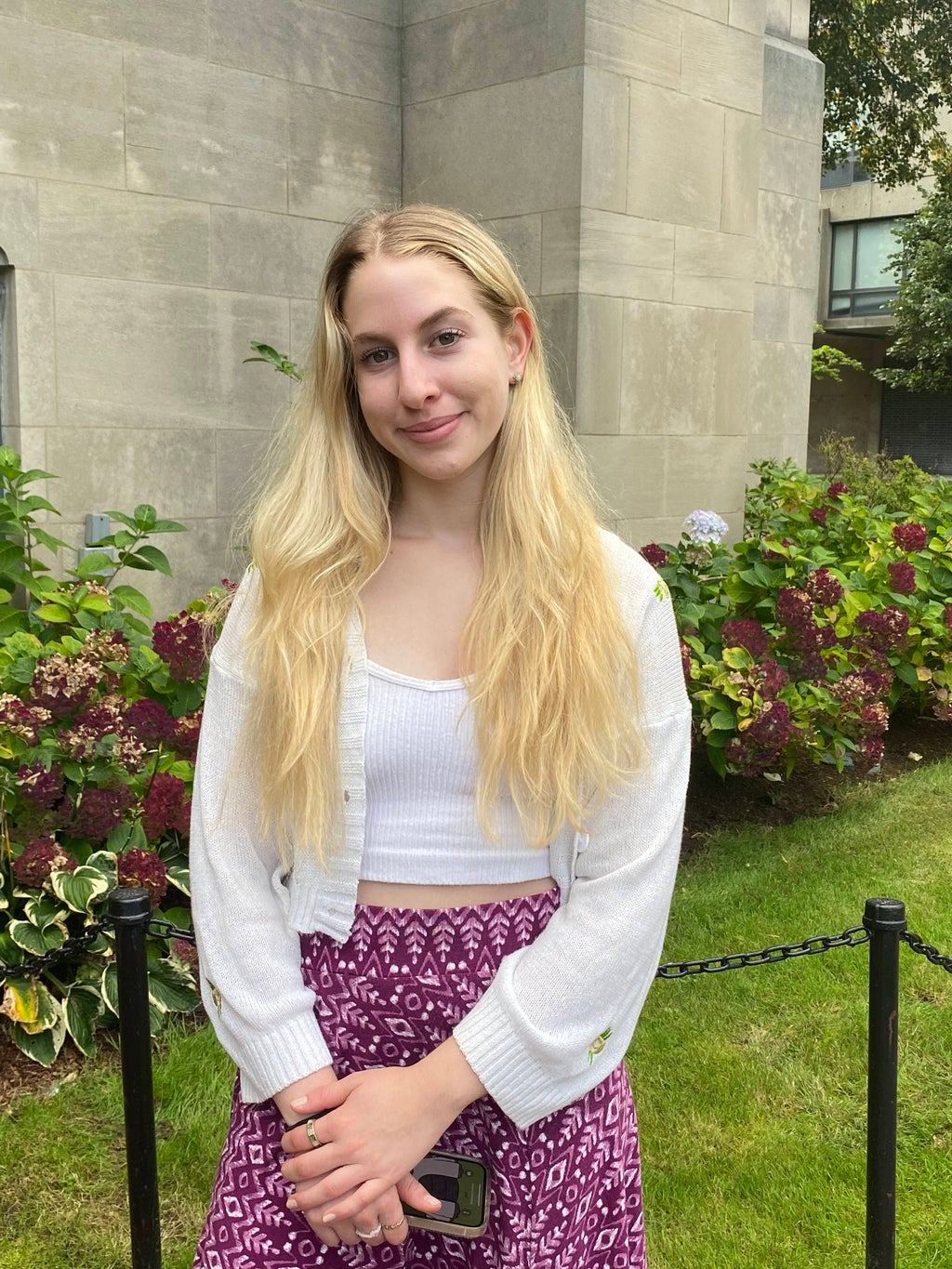 Girl posing for a picture outside