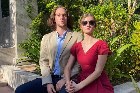woman in bridesmaid dress with boyfriend