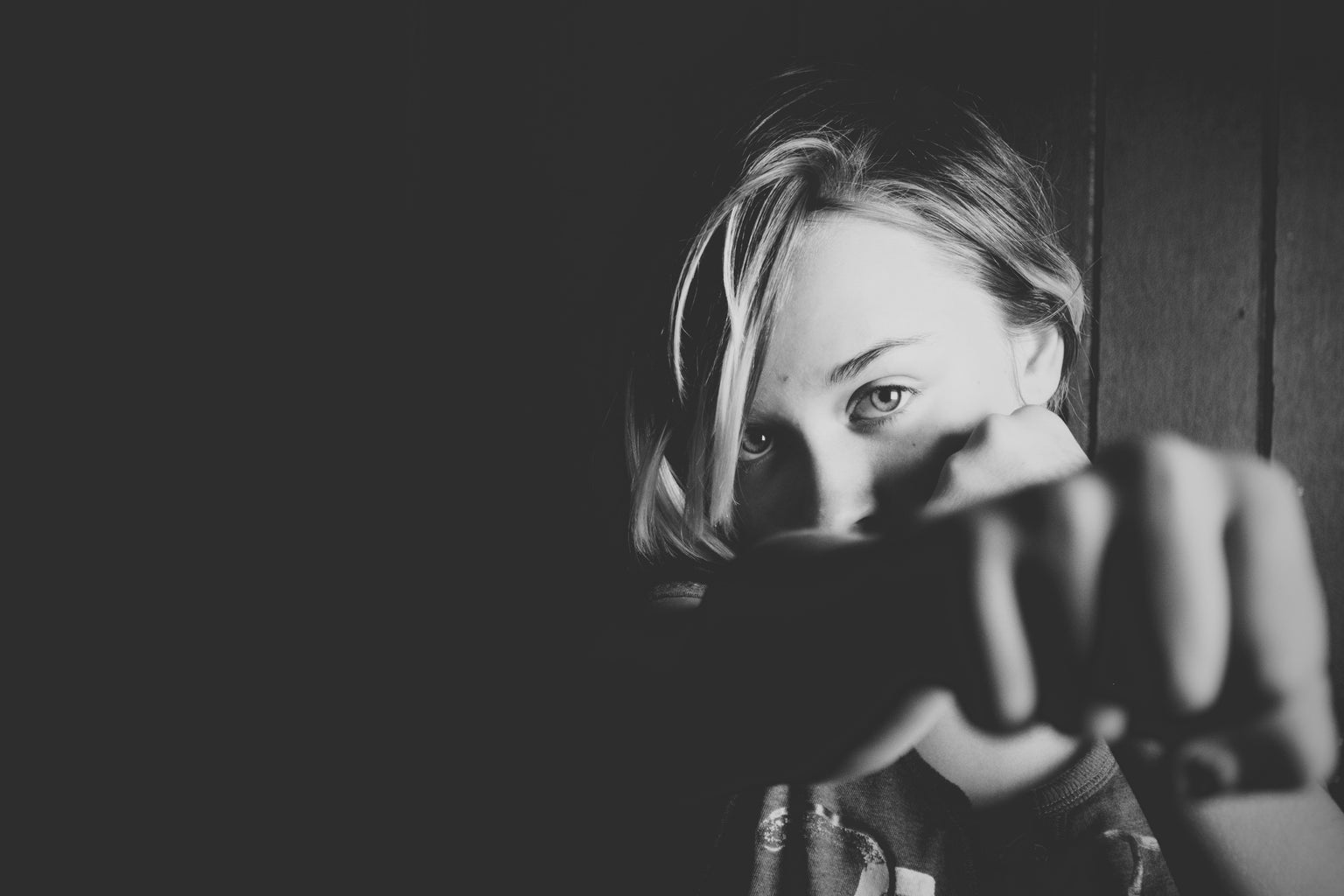 woman throwing fist at camera