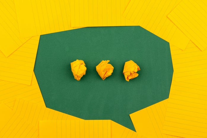 green speech bubble with yellow dots made of paper