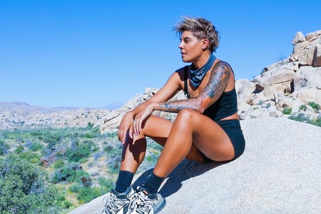 Hannah Rad sitting on a rock