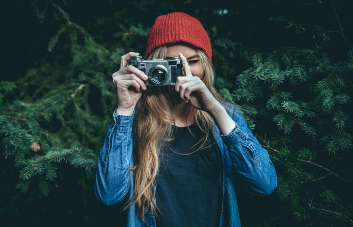 blonde woman holding camera outside by Benjamin Combs from Unsplash?width=719&height=464&fit=crop&auto=webp