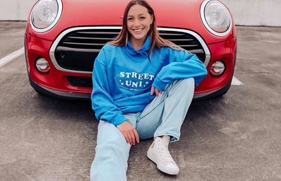 Girl in front of car