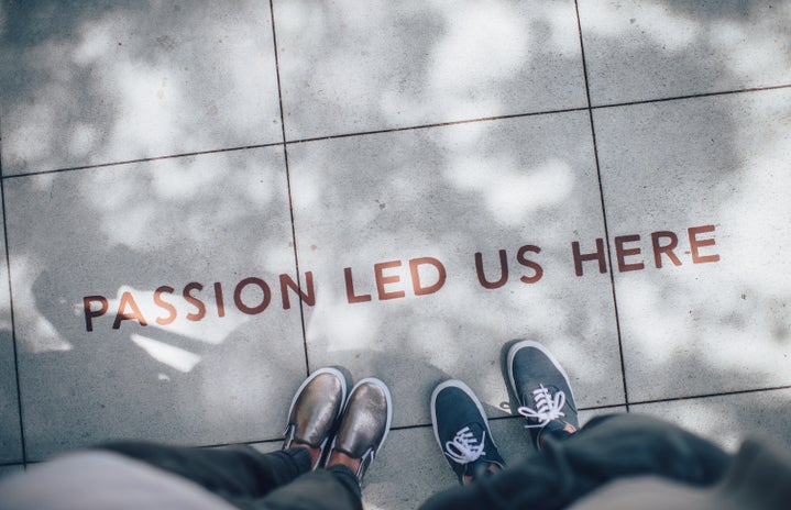 \"passion led us here\" written on pavement