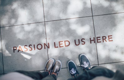\"passion led us here\" written on pavement