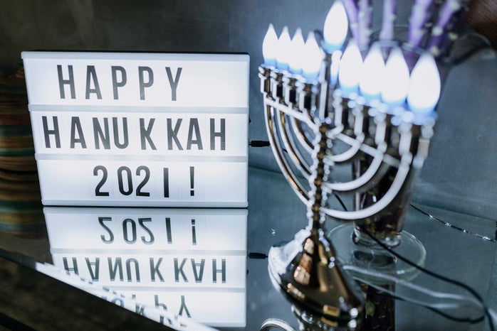 happy hanukkah 2021 sign and menorah