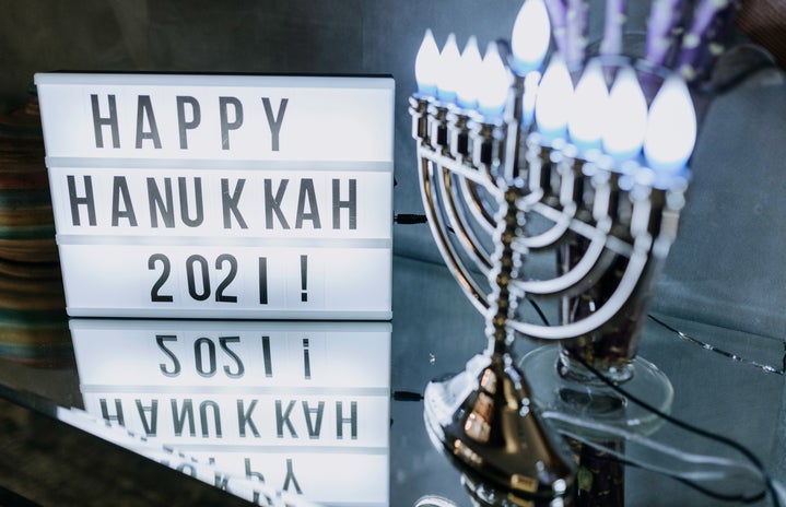 happy hanukkah 2021 sign and menorah