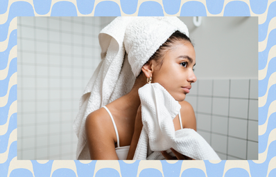 young person drying face with towel