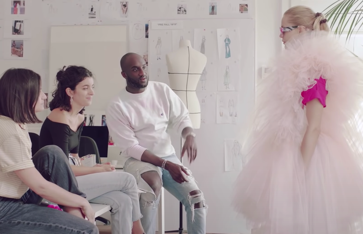 Virgil Abloh and his staff examining a dress on a model
