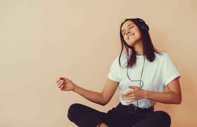 woman listening to music and dancing