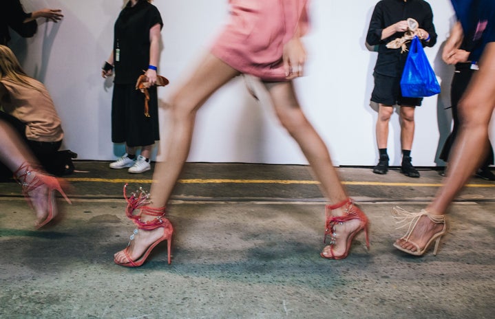 Models rushing to the runway, backstage at Mercedes-Benz Fashion Week Australia