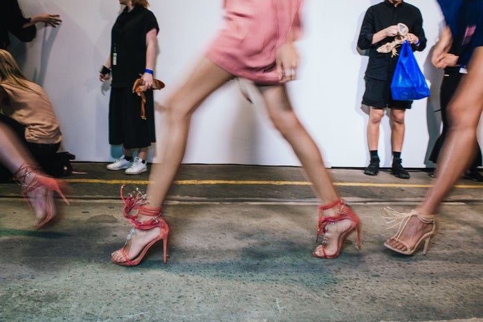 Models rushing to the runway, backstage at Mercedes-Benz Fashion Week Australia
