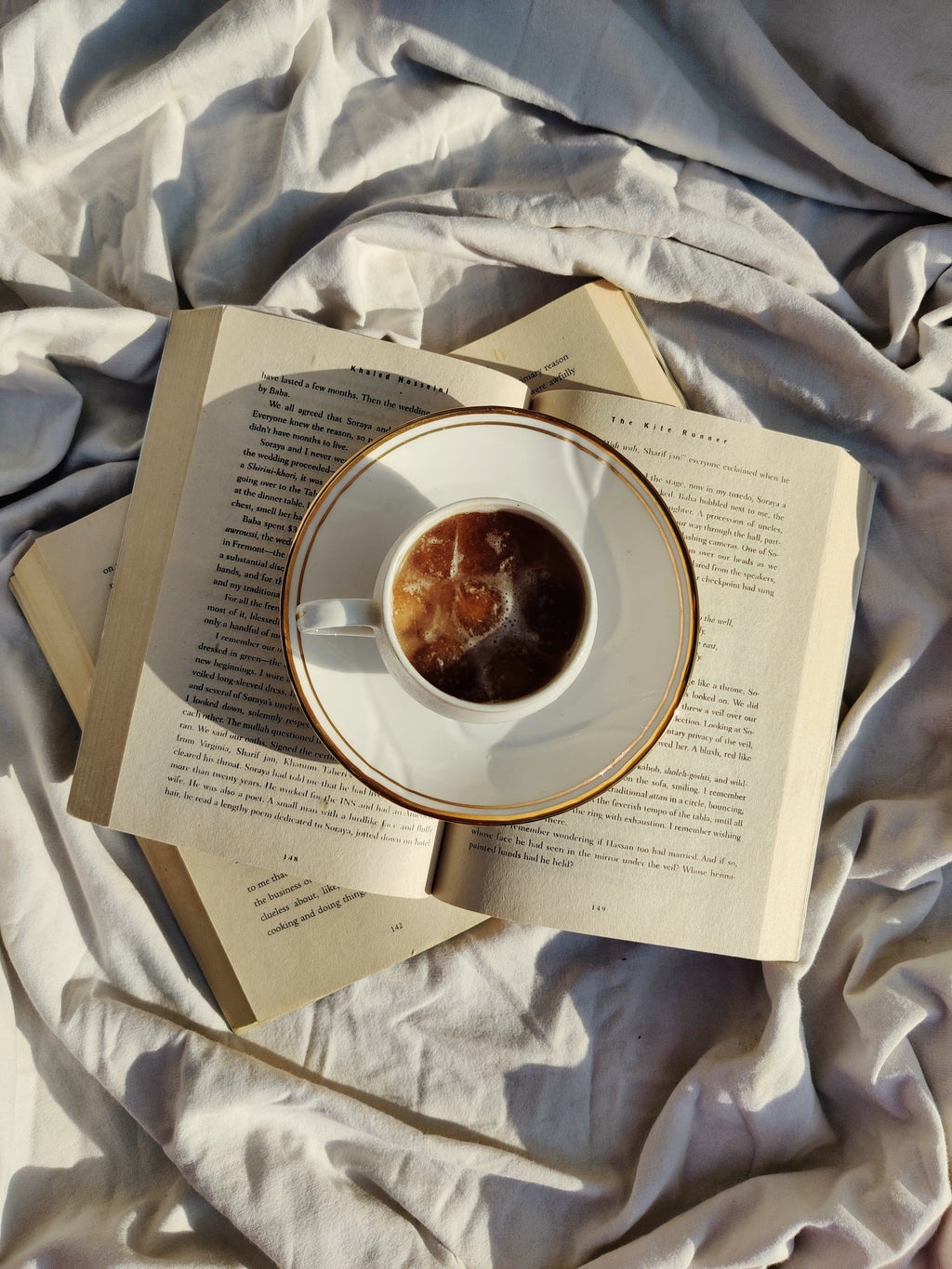 teacup rested on book