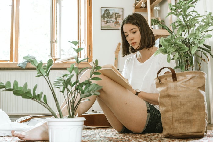 Girl studying surrounded by plants