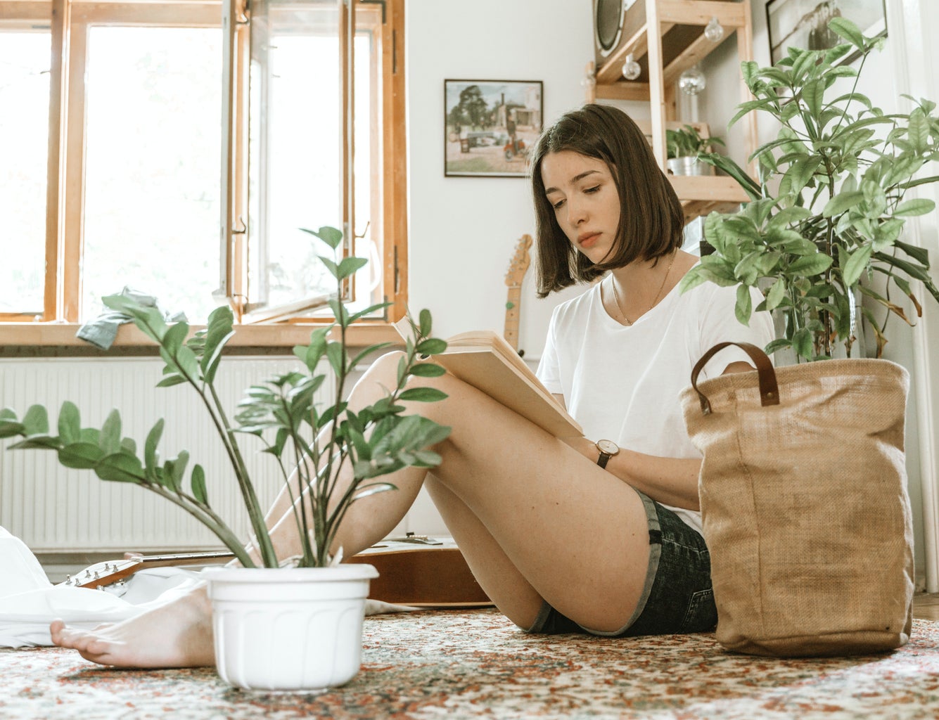 Girl studying surrounded by plants