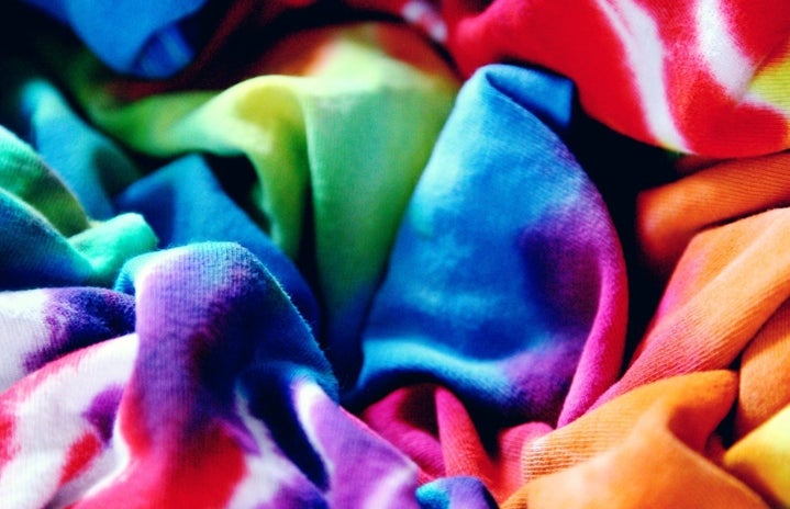 closeup of scrunched tie dye shirts in rainbow colors
