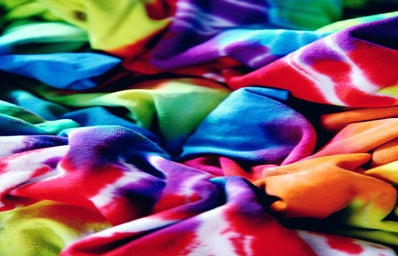 closeup of scrunched tie dye shirts in rainbow colors