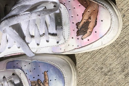 Shoes with michaelangelos hands painted on them