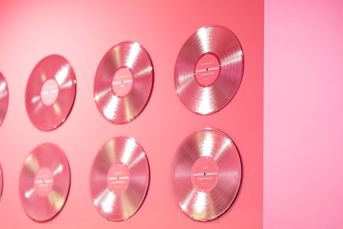 pink vinyl records on a pink wall