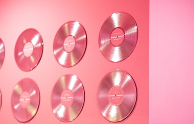 pink vinyl records on a pink wall
