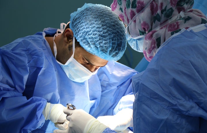 two surgeons performing an operation