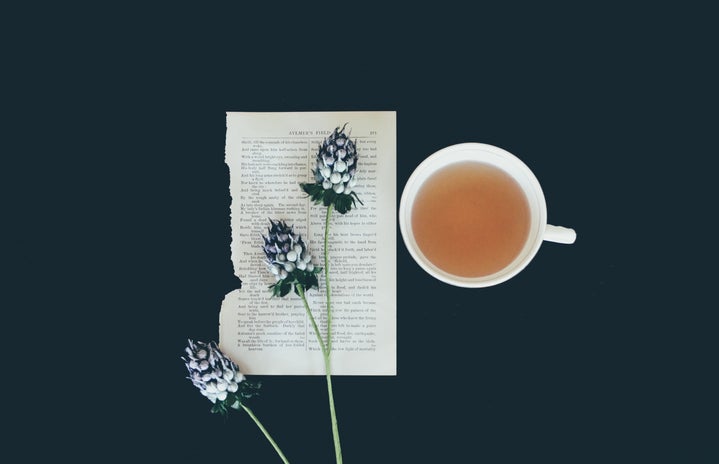 teacup with flower and book page