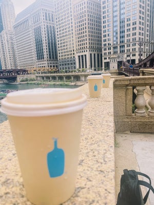 coffees cups with city in background