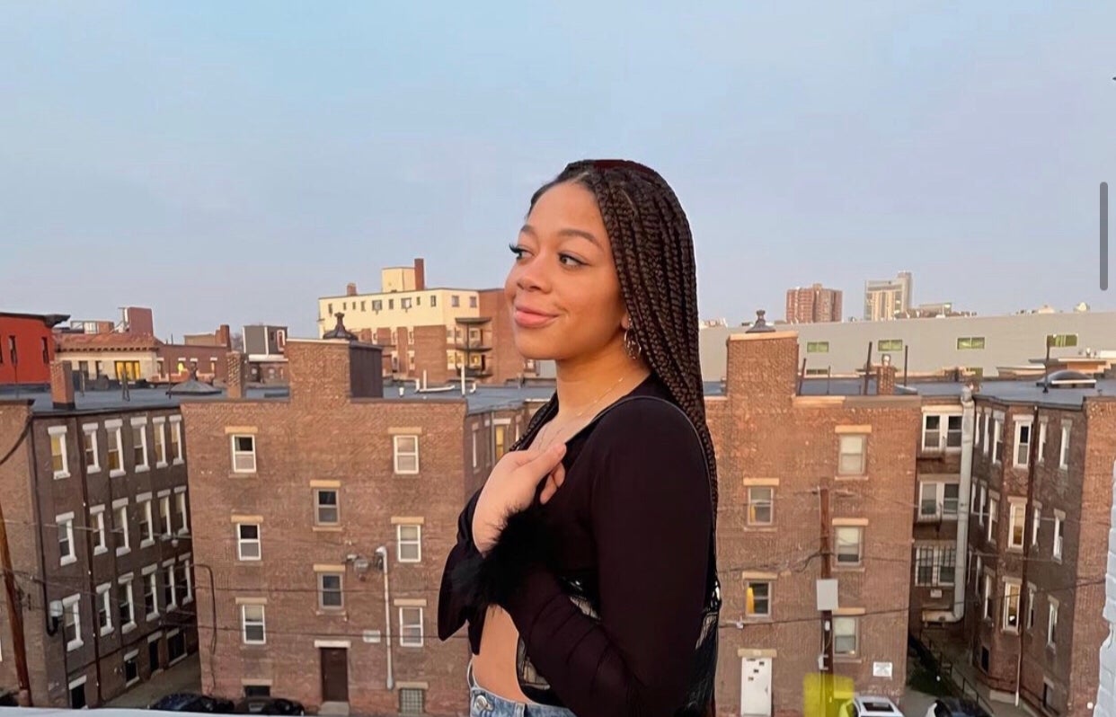 Young woman with city skyline behind