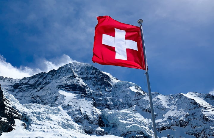 Switzerland flag in mountains