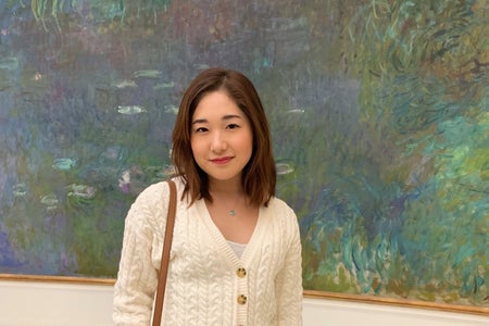 Woman in front of a painting