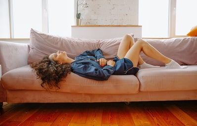 woman lying on couch