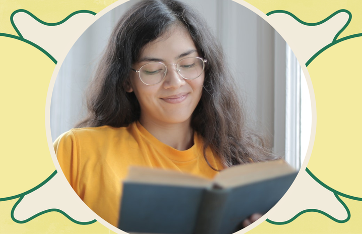 woman smiling reading book