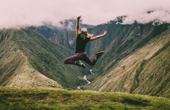 woman jumping in nature