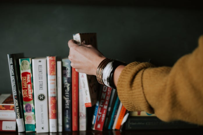 woman looking through books by Christin Hume on Unsplash?width=698&height=466&fit=crop&auto=webp
