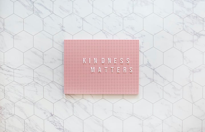 Kindness matters, be kind always. Pink pegboard on while tiles.