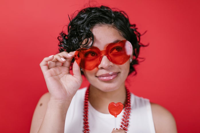 woman wearing heart shaped sunglasses