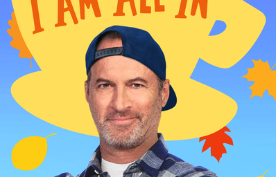 Blue, yellow and orange podcast logo featuring Scott Patterson in a blue cap and flannel shirt with the words \"I Am All In\" written on a yellow coffee mug with leaves falling in the back