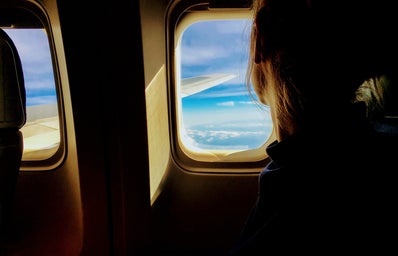 Person looking outside of an airplane