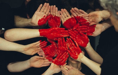 Hands in Red Heart