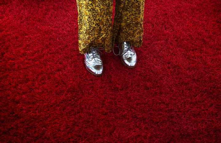 feet on a red carpet