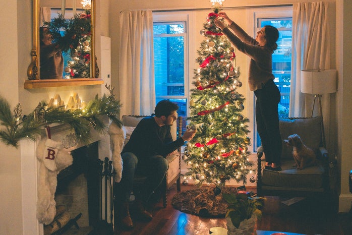 couple decorating Christmas tree by Caleb Fisher?width=698&height=466&fit=crop&auto=webp