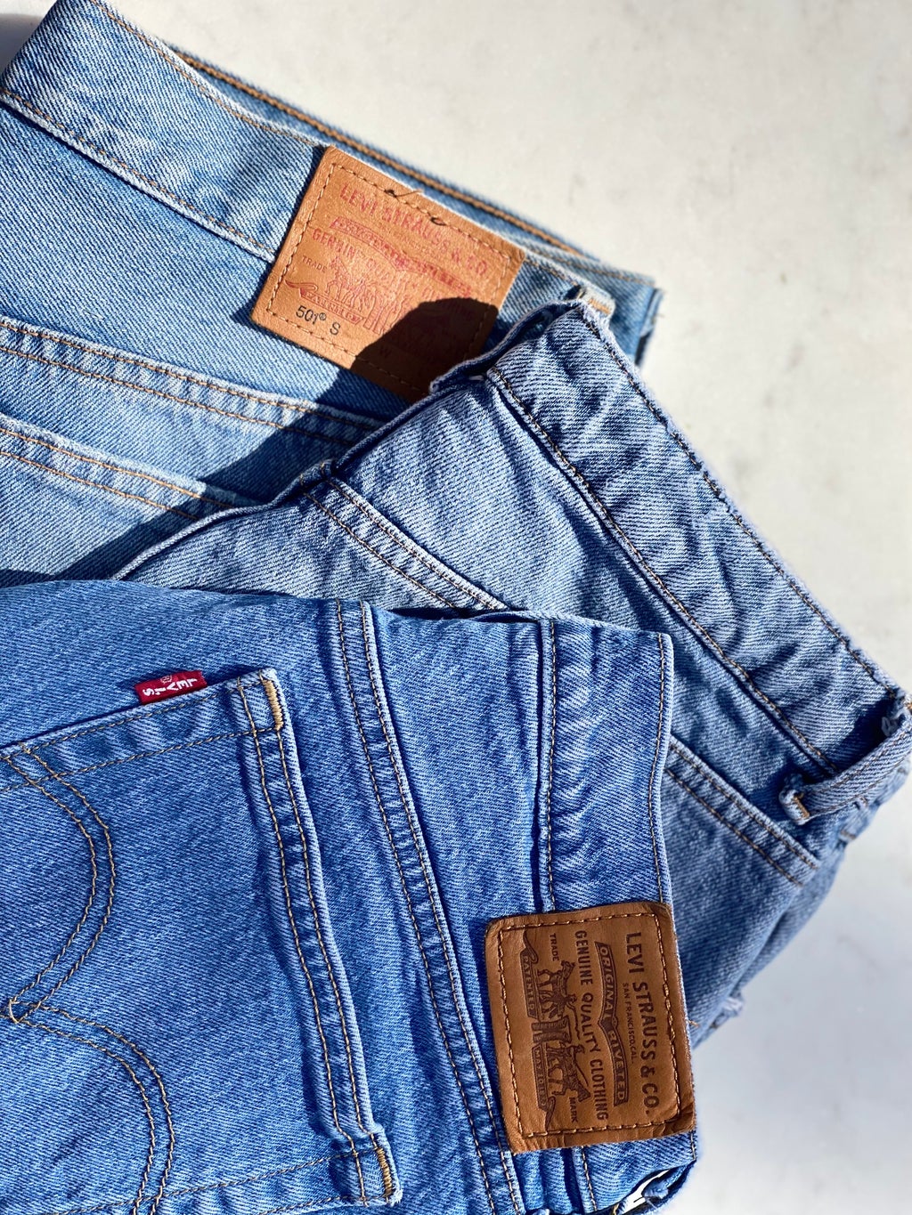 Denim jeans on top of one another