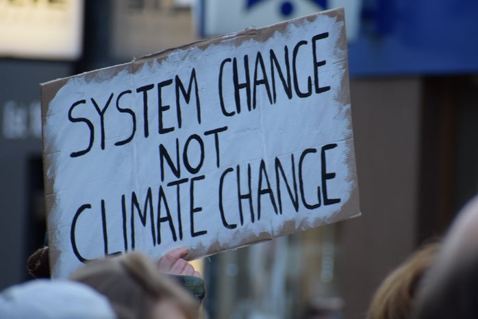 person holding climate change sign