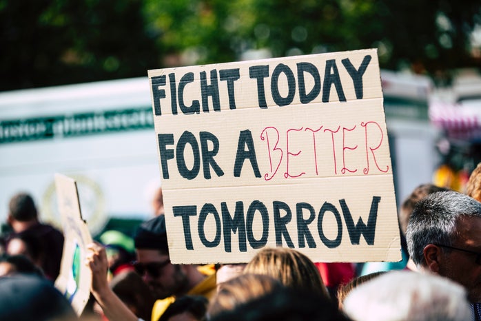 protest sign that says "fight today for a better tomorrow"